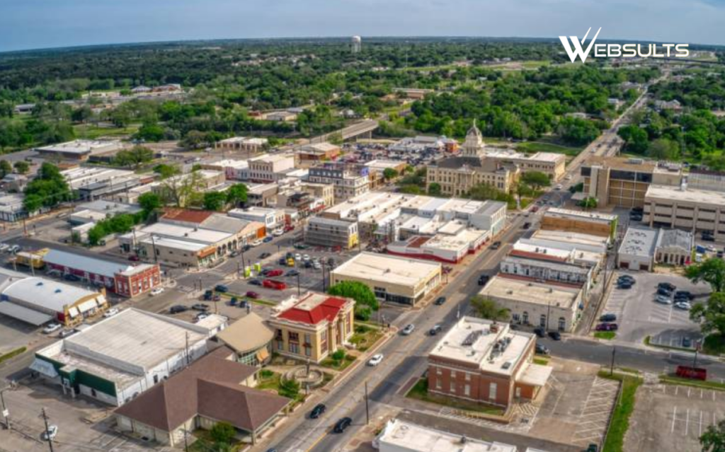 Aerial view of downtown Salado, Texas, with historic buildings and tree-lined streets